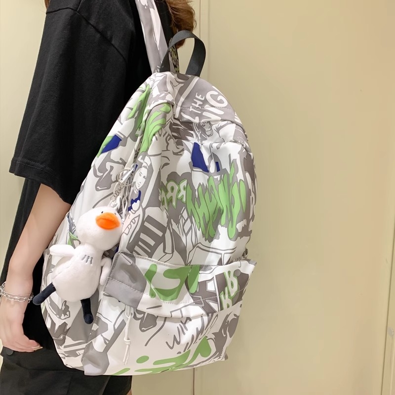涂鸦印花双肩包女2025新款夏韩版潮流休闲背包男高中大学生书包女