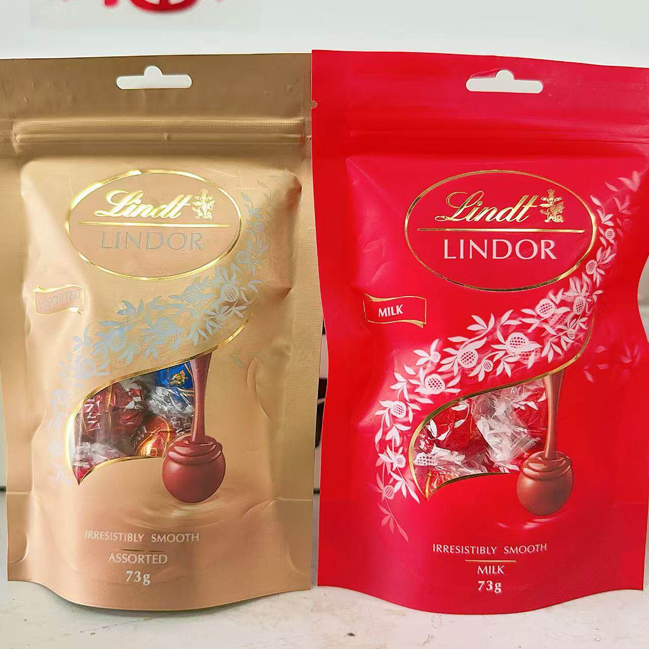 瑞士进口瑞士莲软心牛奶巧克力精选巧克力分享装73g袋装喜糖临期