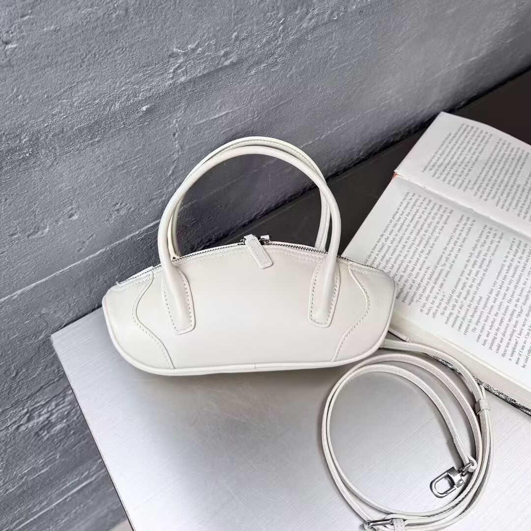 小众春夏新品真皮女包甜美淑女百搭时尚头层牛皮手提单肩小饺子包