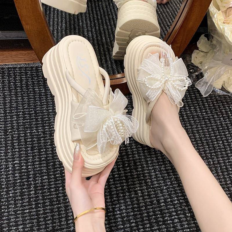 欧洲站珍珠蝴蝶结松糕一字拖女2025夏季新款8cm增高跟厚底凉拖鞋