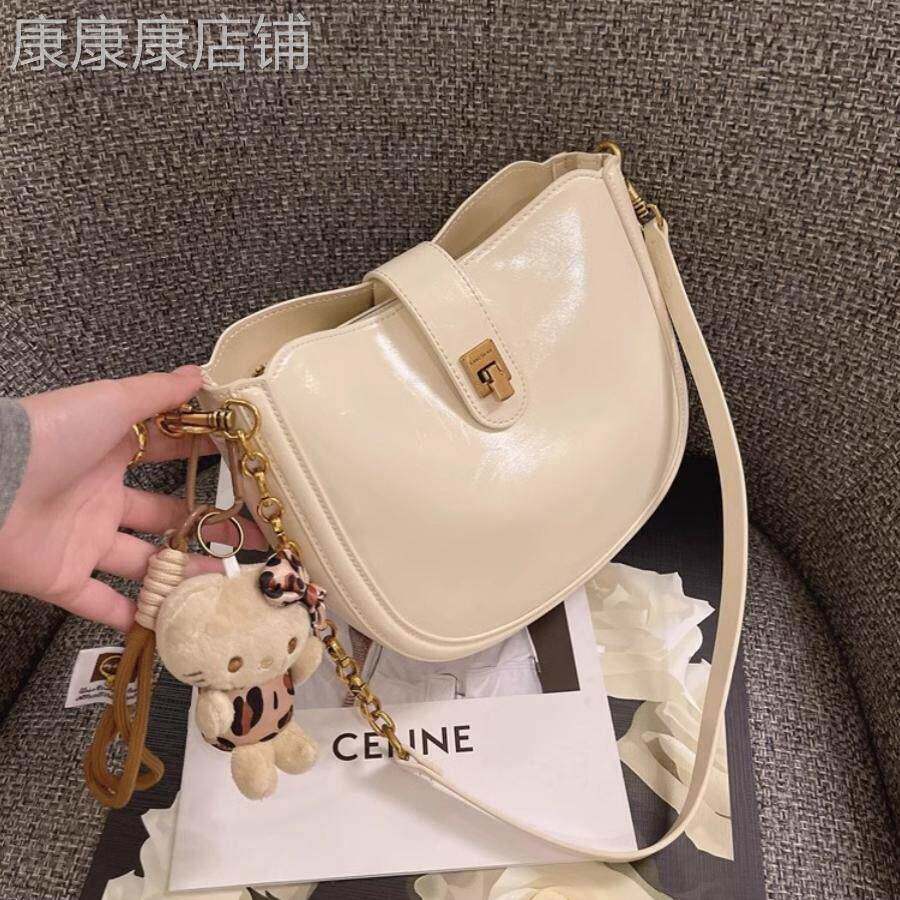 法国正品MK Jessie半圆马鞍包包女高级感单肩斜挎包真皮腋下女包
