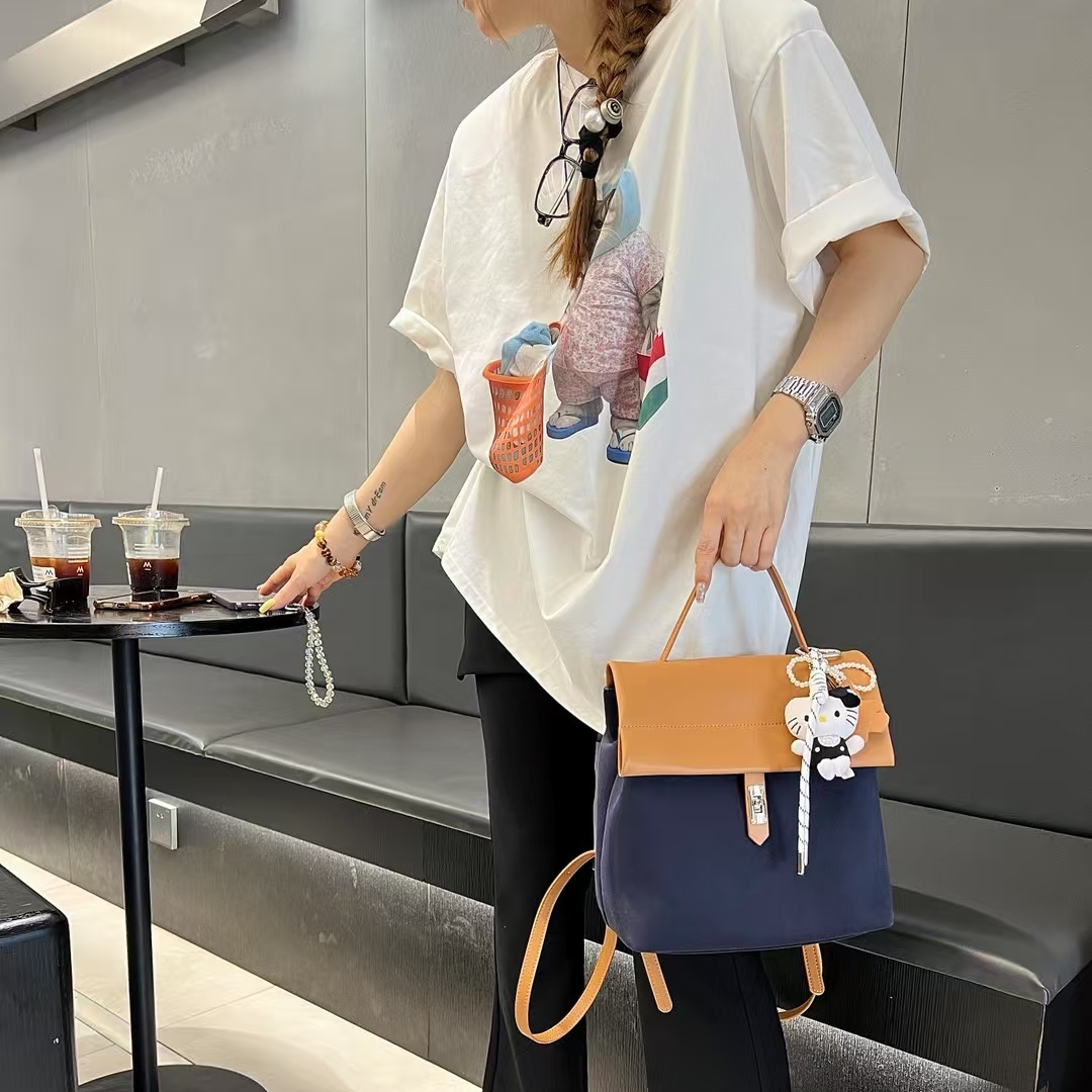 MJ女包2025新款帆布配牛皮拼接休闲双肩背包百搭洋气大容量通勤包