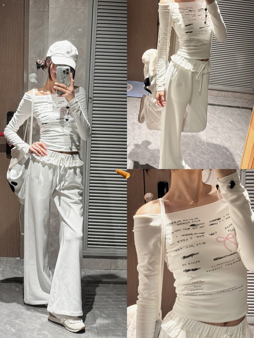 Model wearing a white off-shoulder printed long-sleeve top with wide-leg lounge pants