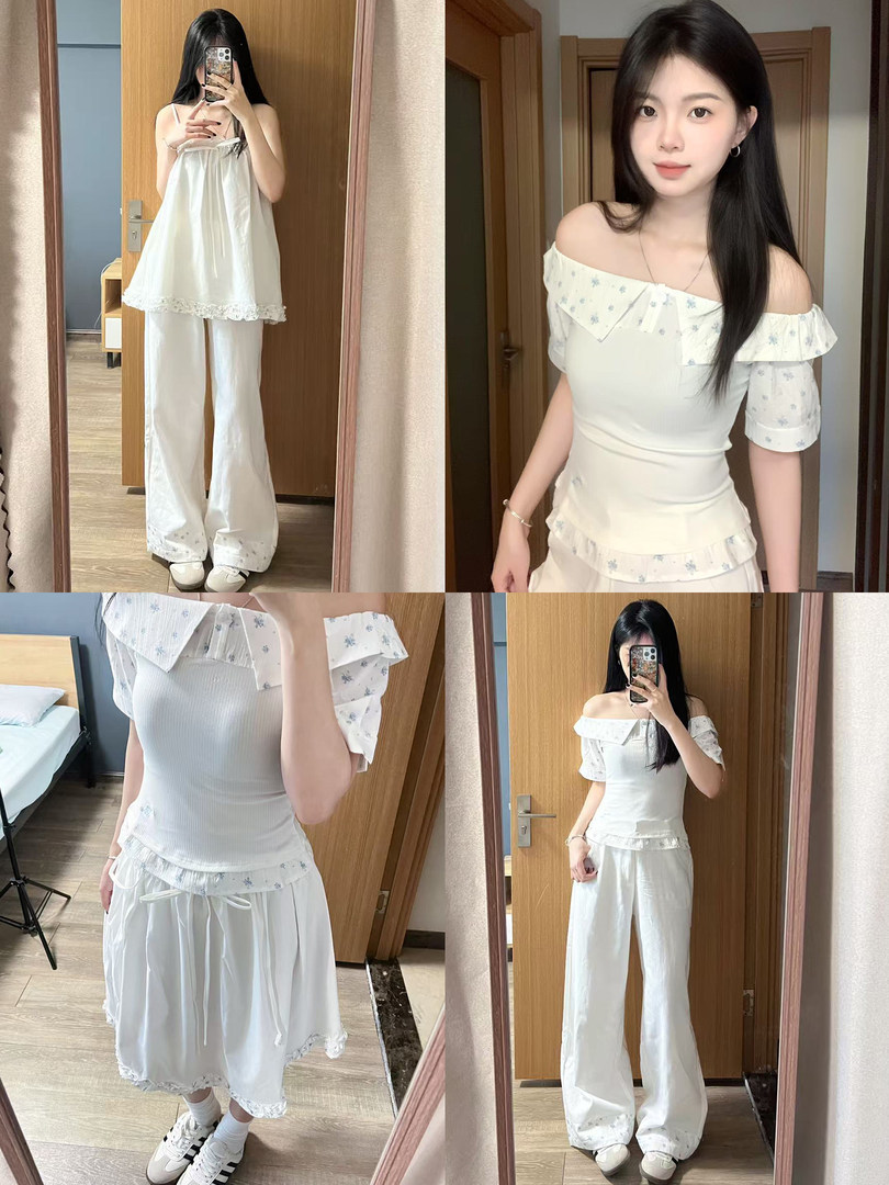 Woman modeling a white off-shoulder floral top with matching wide-leg pants