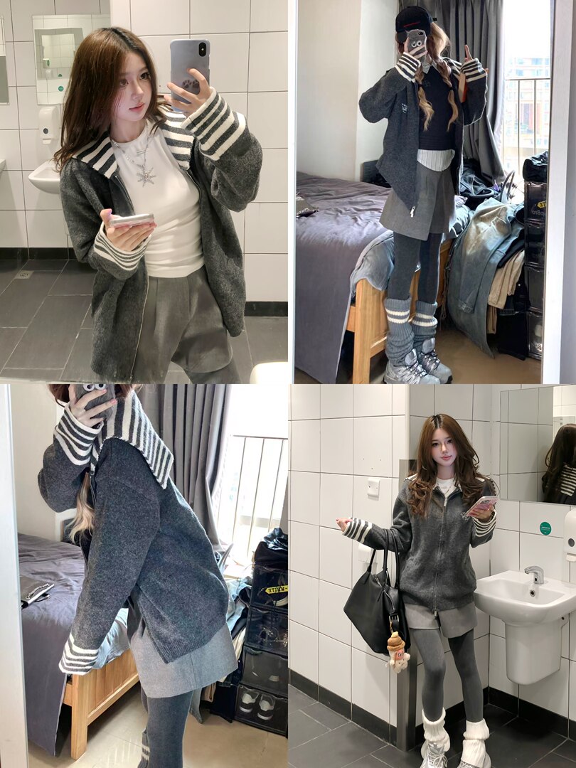 Model wearing a gray zip-up cardigan with striped cuffs and layered casual outfit