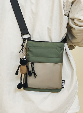 韩国ins休闲潮流斜挎包女2025春夏时尚运动便携牛津布手机包百搭