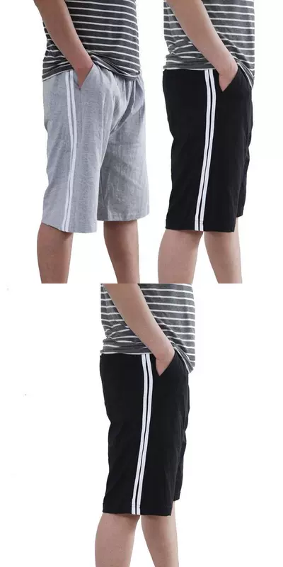 Mùa hè cotton nam năm điểm quần pyjama nhà 7 phần mỏng lỏng rộng kích thước quần bãi biển nhà quần short giản dị - Quần bãi biển