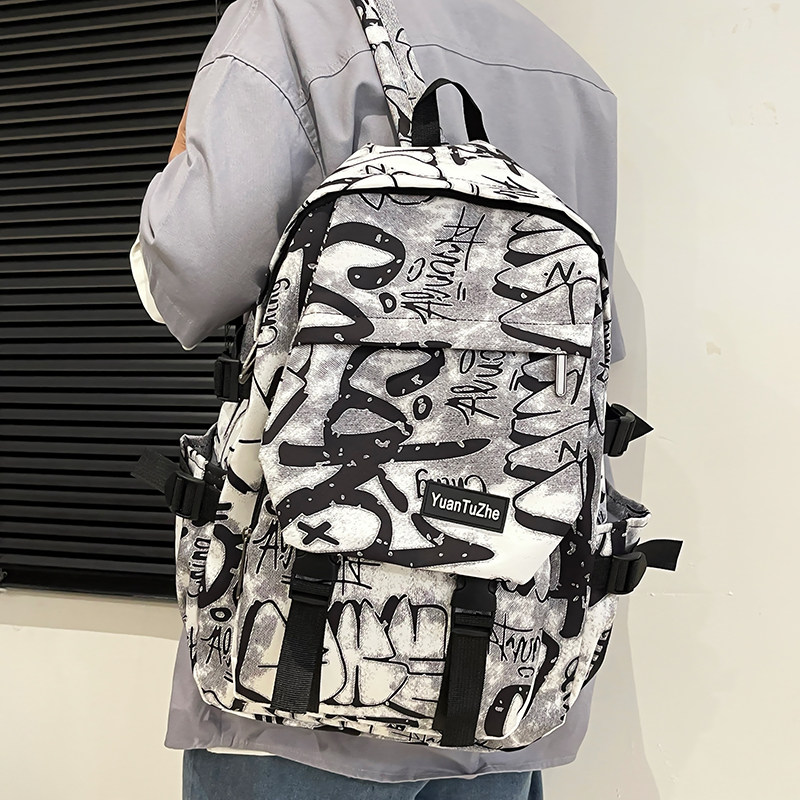 街头潮流涂鸦印花双肩背包初中生男女学生大容量校园书包个性背包