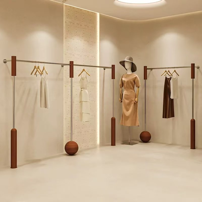 女装店中古风上墙不锈钢展示架图片