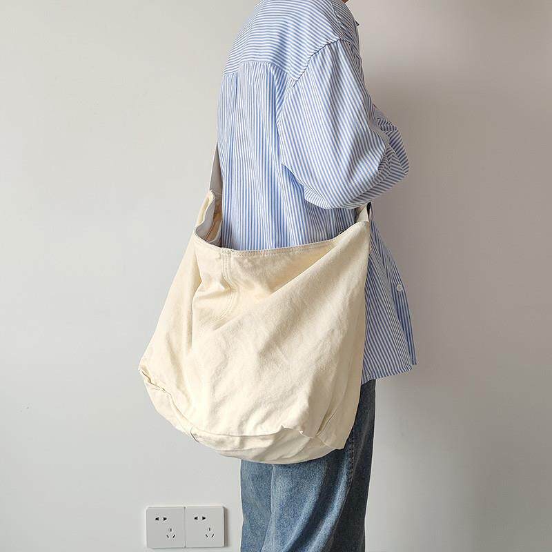 大容量帆布包宽肩带水洗做旧单肩包男女学生书包休闲百搭斜挎包潮