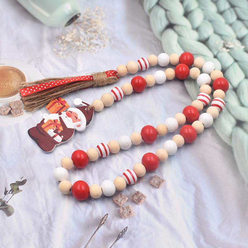 2022. Santas ropes are swirling, colored wooden beads are h