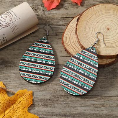 The Omegas Aztec wooden earrings stamped with water-shaped