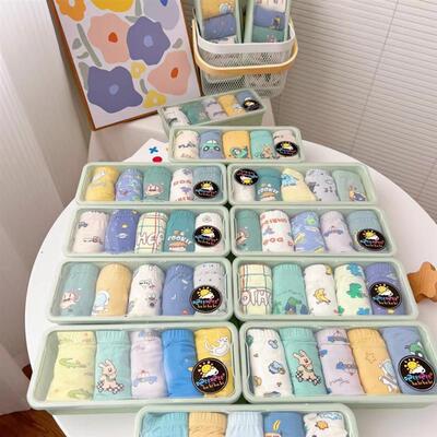 Children  s panties in boxes filled with boy-girl shorts, l