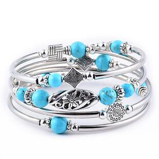 The natural pinestone/tiger eyestone entangles the bracelets