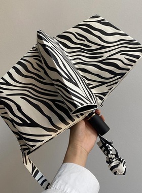 暖黄白色斑马雨伞女加厚防风紫外线三折叠晴雨两用黑胶自动遮阳伞