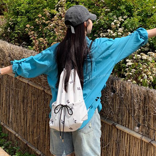 韩系ins2026新款白色甜美蝴蝶结印花抽带式束口双肩包大容量背包