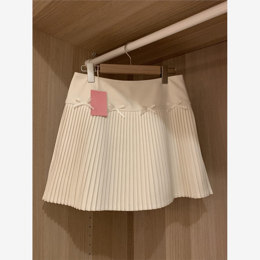 2025新款miu系穿搭白色毛呢半身裙子女秋冬a字包臀裙加厚百褶短裙