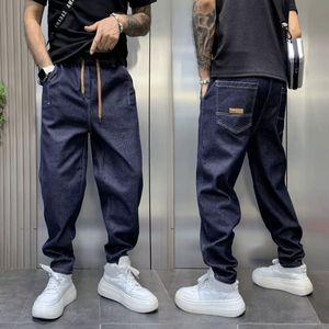 春秋新款男士蓝色水洗牛仔裤宽松大码老爹裤小脚哈伦裤休闲长裤潮