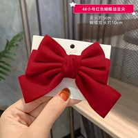 Маленькая красная заколка для волос с бантиком