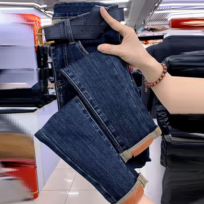 蓝色高腰皮标弹力九分小脚牛仔裤