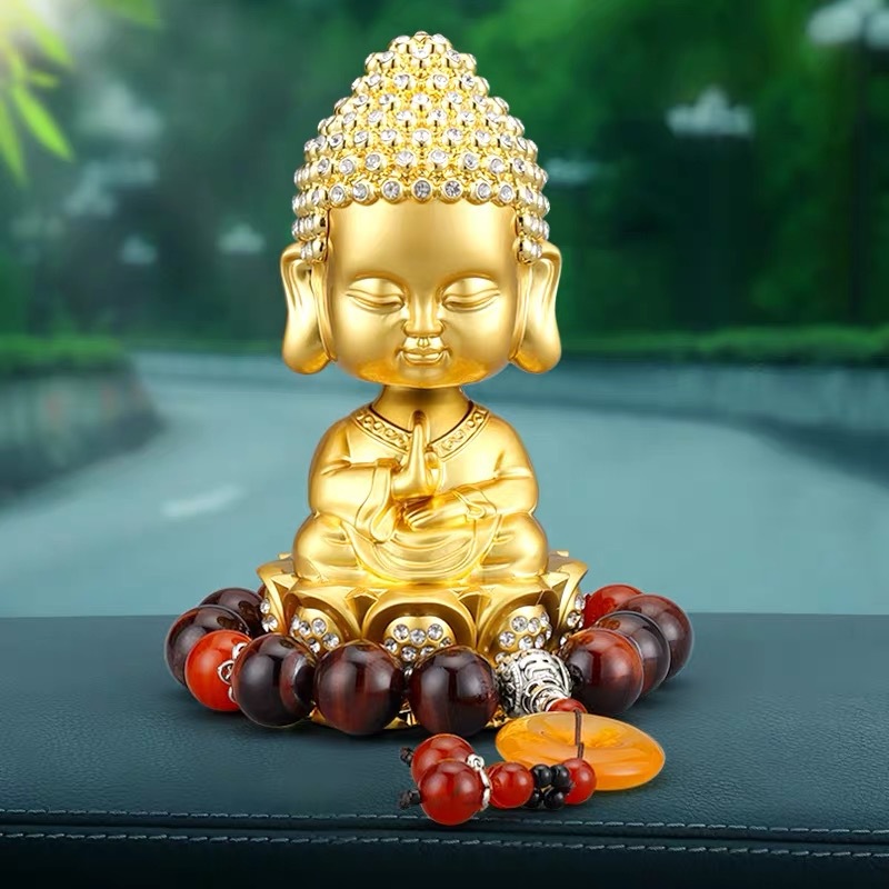 汽车香水摆件弥勒佛高档车载香氛摇头小和尚沙弥车内装饰用品