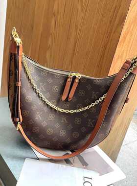 优酷迪斯UK女包2025新款月牙包高感原创轻奢时尚新印花单肩斜挎包