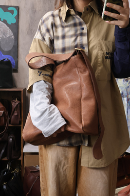 野兽原创粗肩带多隔层水桶包斜挎单肩包头层素面无涂层牛皮盘出油