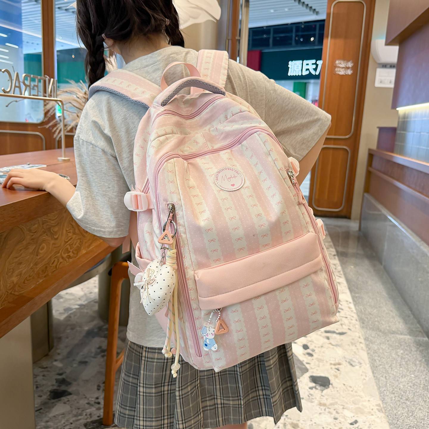 官方正品书包女少女风初中高颜值条纹蝴蝶结双肩包女小学生轻便大