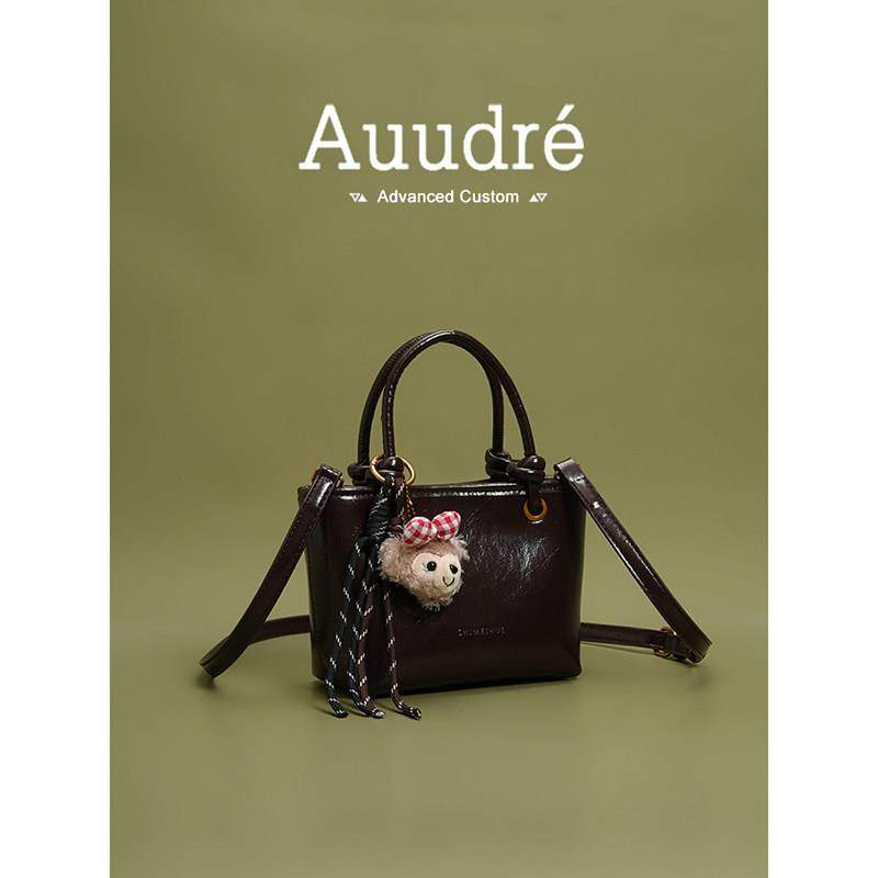 天锚国际春夏季覆古亮面手提水桶包包女式2026新款通勤斜挎包小拎,箱包皮具/热销女包/男包,水桶包,淘宝优惠券,粉丝福利购,淘宝优惠卷