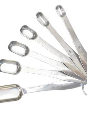 Unspoiled steel six-packed spoon baked with a typographic me