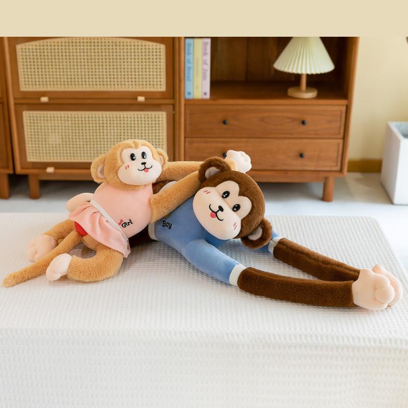 Furry toy lover monkey present to bed-stressed dolls with