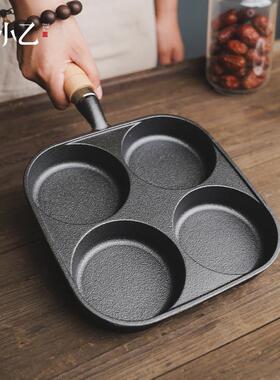 A four-hole fried egg pan with no coated egg burger mold.