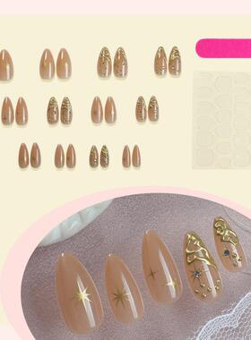 Twenty-four pieces of gold-coloured patches in a cape-O-M-M-