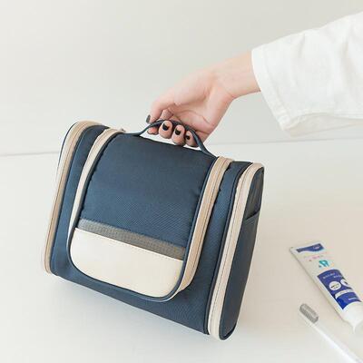 The handheld with a thick scrubber and a wash-up bag, and th
