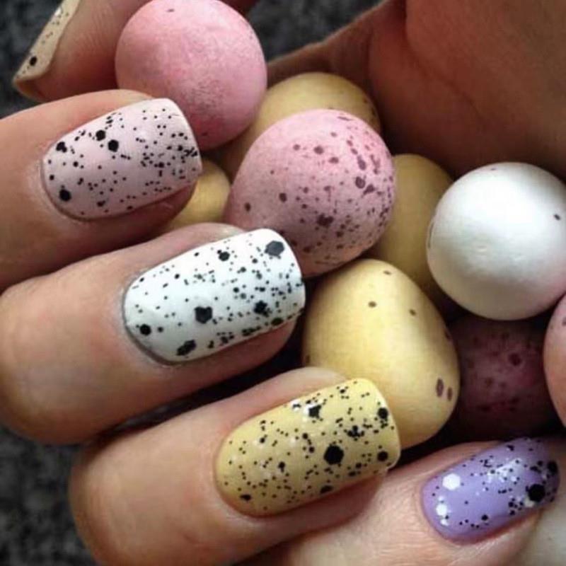 Nail-painted Easter nail-coloured egg-shell rabbits are desi
