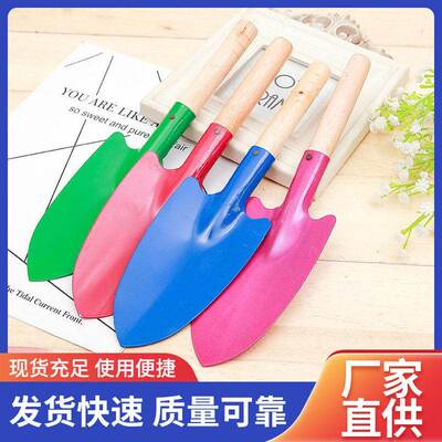 Small trowel, spade, shovel for gardening, planting flowers,
