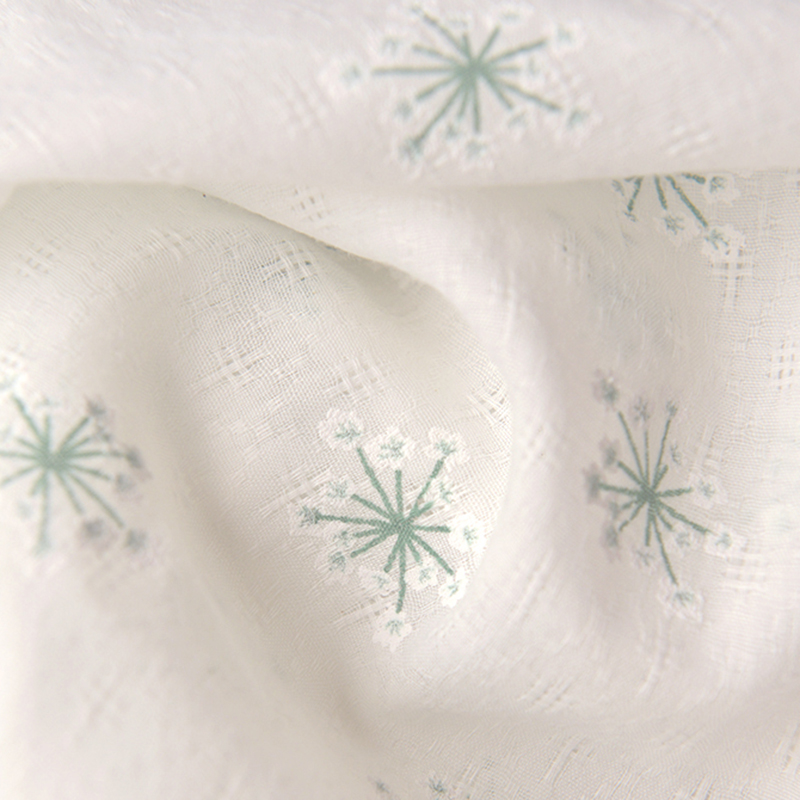 米白蒲公英花簇提花暗菱格涤棉布