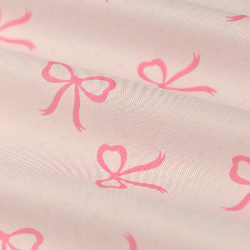 嫩粉蝴蝶结暗圆点涤纶布 春秋度假风发圈小背心吊带连衣裙子面料