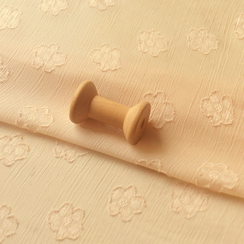 米黄提花瓣肌理雪纺布料diy婚纱