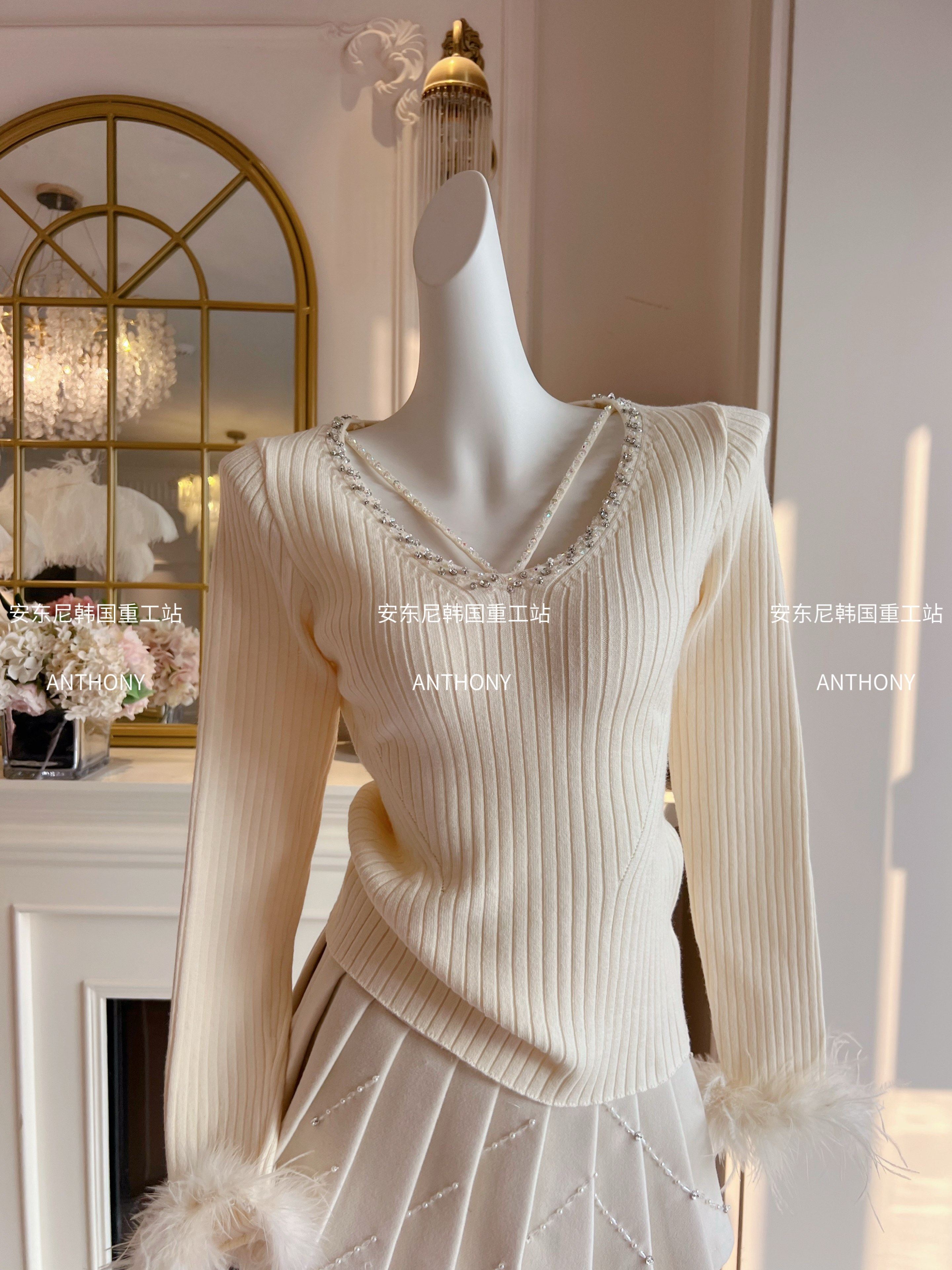 辣妹纯欲风气质针织衫女重工镶钻镂空修身显瘦套头长袖鸵鸟毛毛衣