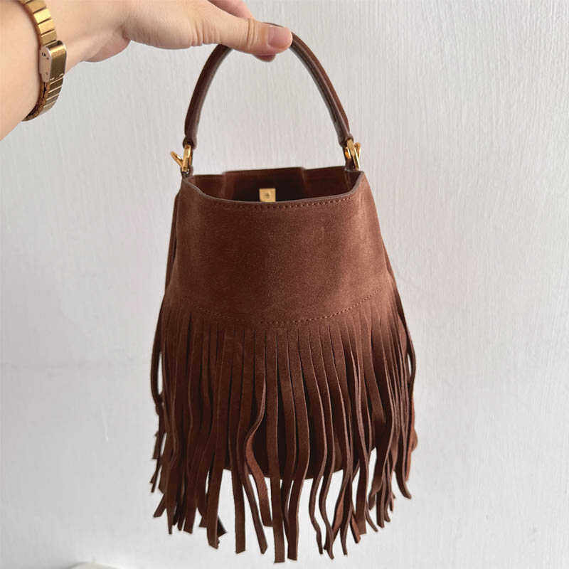 美拉德真皮女包~慵懒时尚磨砂头层牛皮流苏水桶包手提单肩斜挎包