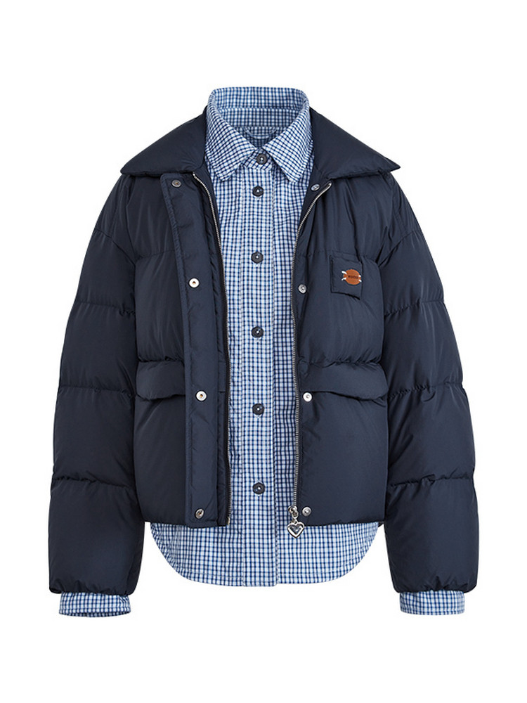 Navy puffer jacket layered over a blue checkered button-up shirt on a white background