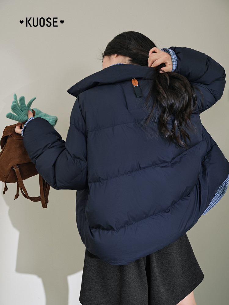Model wearing a navy oversized puffer jacket