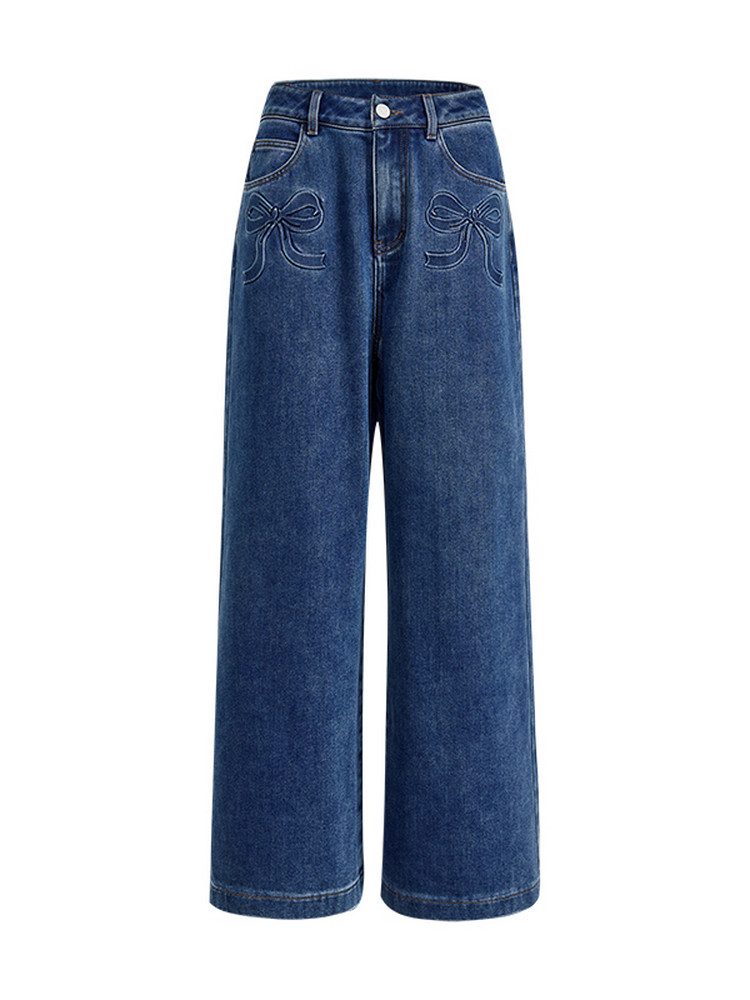 Blue wide-leg denim jeans with bow embroidery on a white background