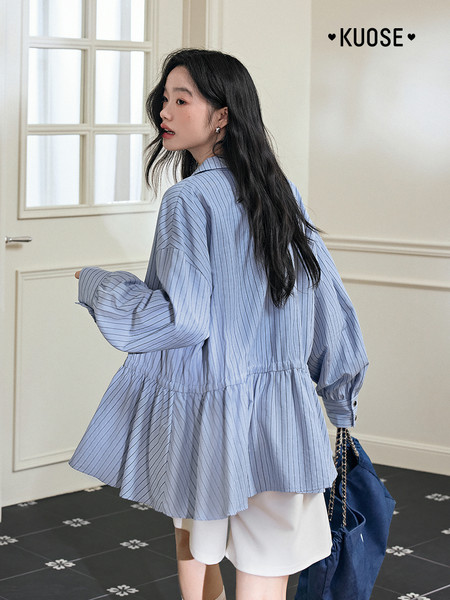 Woman wearing a blue striped long-sleeve blouse