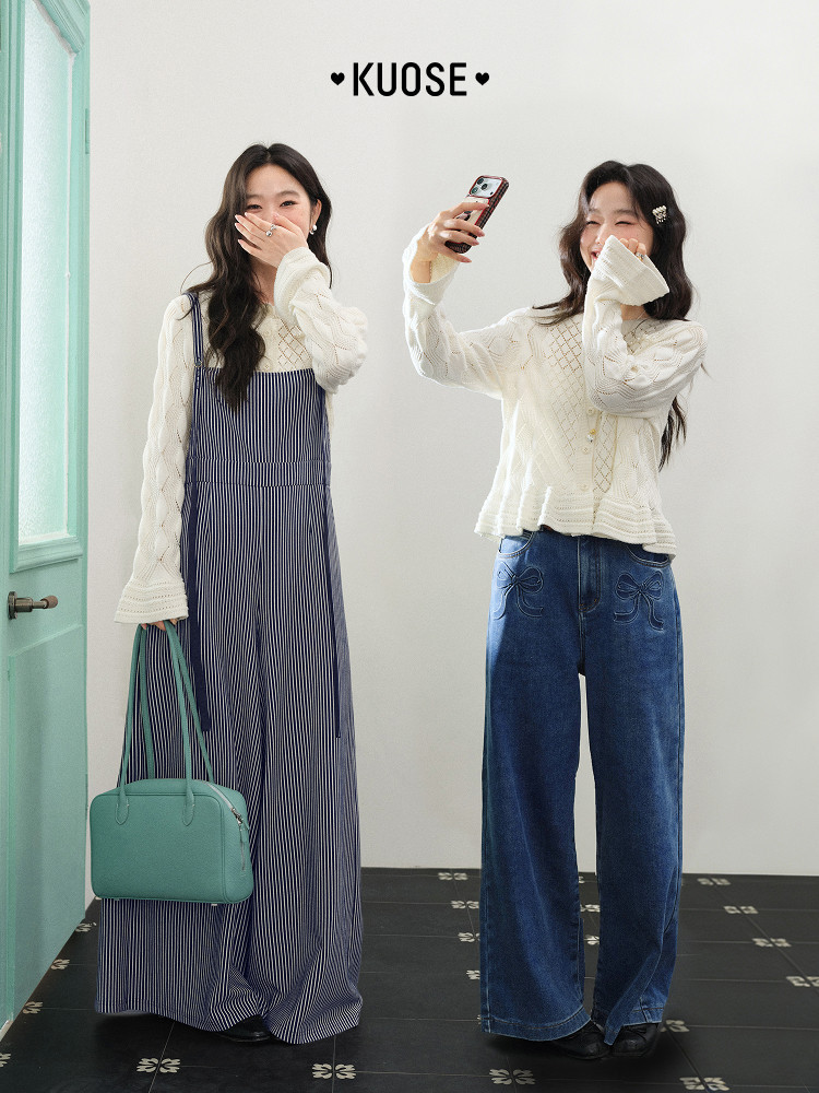 Two women modeling white knit tops styled with a striped jumpsuit and blue jeans, with a teal handbag