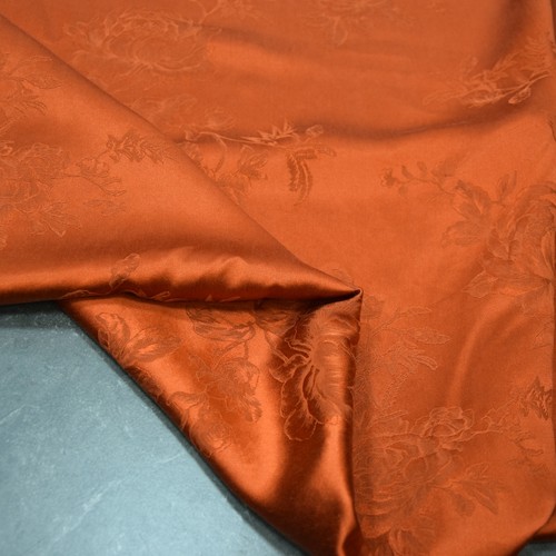 纯色橘红提花重缎香云纱面料