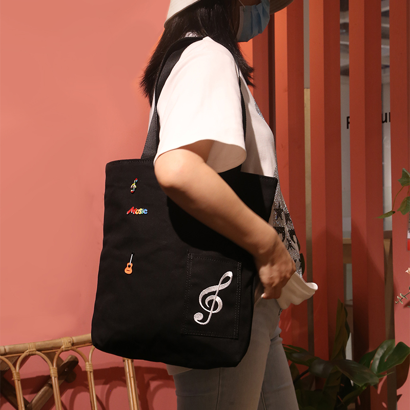 日系新款乐谱包创意音符钢琴大容量休闲小众绣花单肩帆布包女定制
