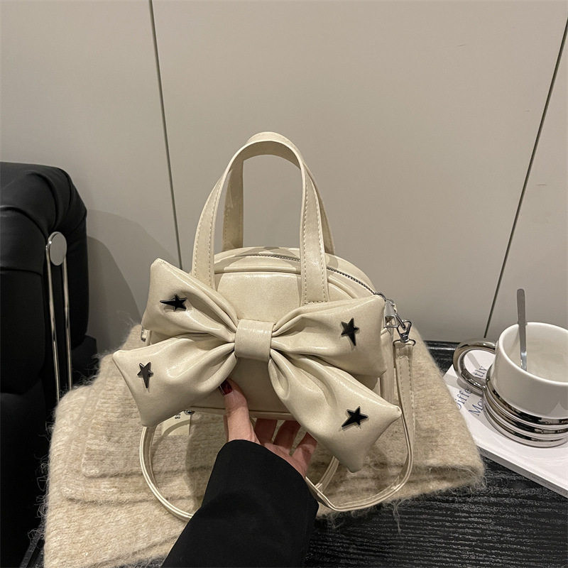 可爱蝴蝶结女士手提包2026春季单肩斜挎时尚百搭韩版小方包高级感