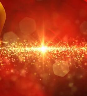 绚丽光线金色粒子中心发散红色旗帜飘扬五十一晚会舞台背景视频